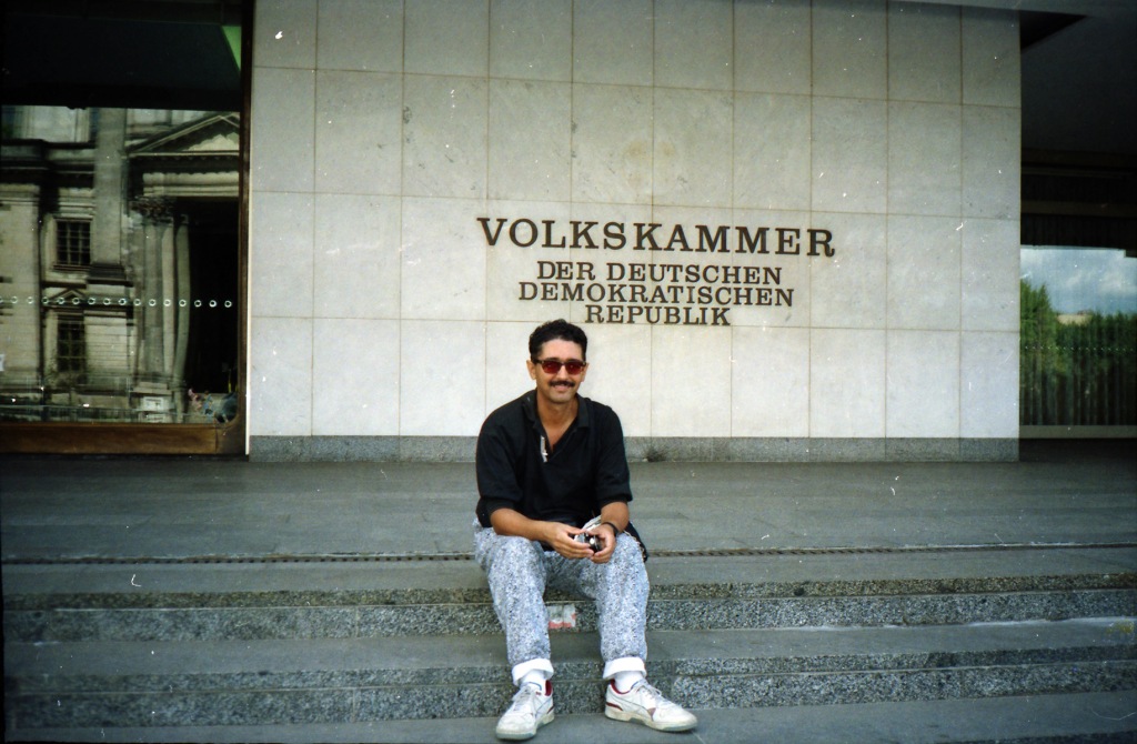 This was a few months after the opening of the wall. Certainly not before, - I can't imagine sitting on the steps of the East German Parliament grinning luridly in my weird 1990s jeans. That just was not done. 